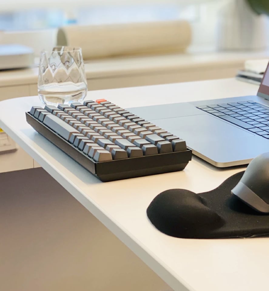 an image of a glass and keyboard